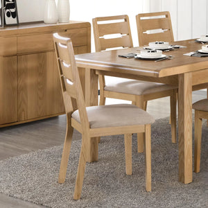 Wooden dining table with chairs in a room setting