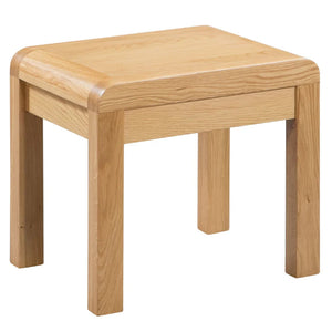 Wooden stool with a light brown finish on a white background