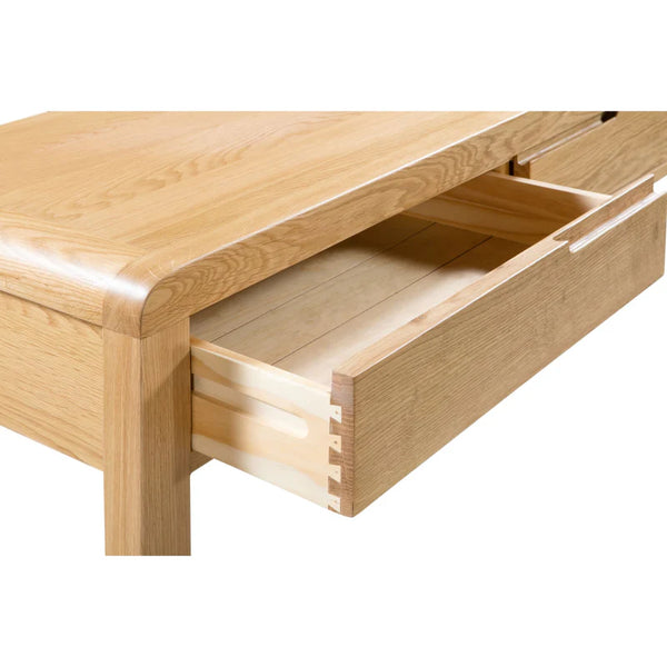 Wooden drawer unit with a single open drawer on a white background