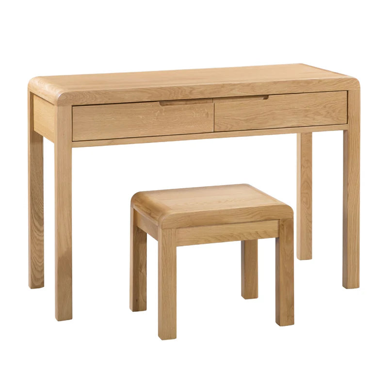 Wooden desk with two drawers and a matching stool on a white background