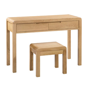 Wooden desk with two drawers and a matching stool on a white background