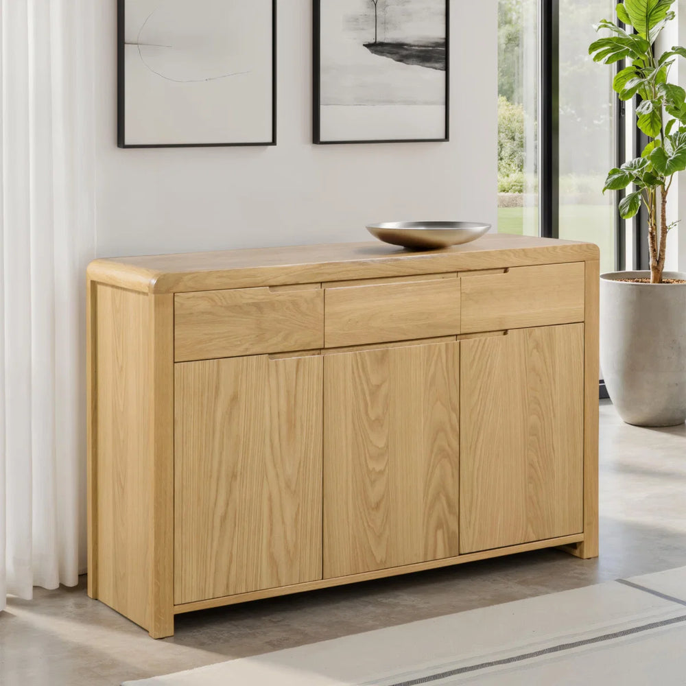 Wooden sideboard with drawers and doors on a white background