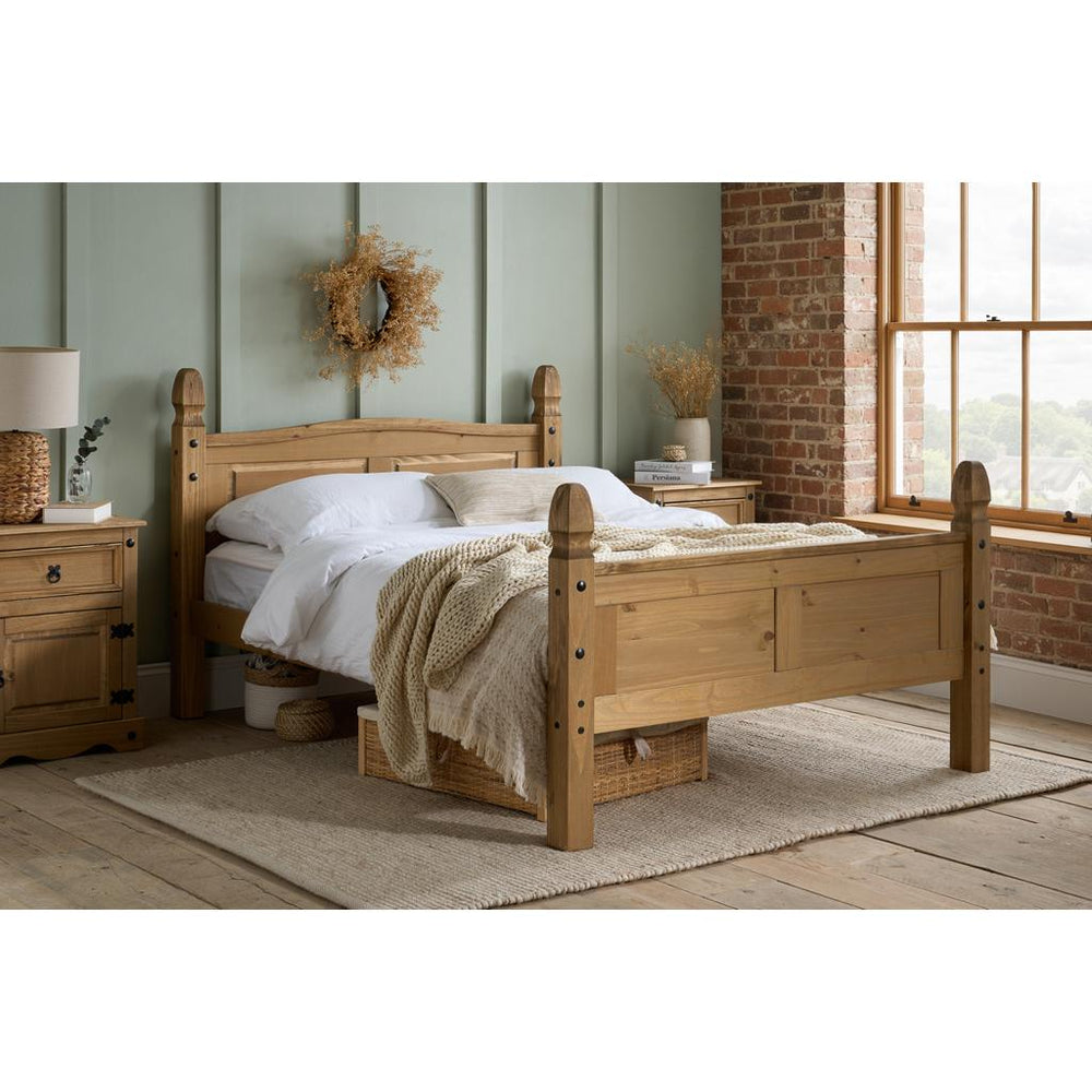 Wooden bed frame with white mattress on a white background