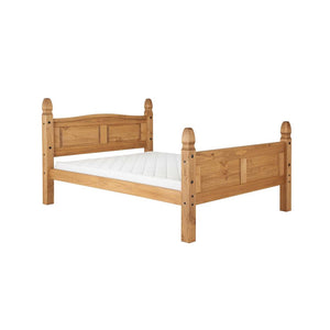 Wooden bed frame with white mattress on a white background