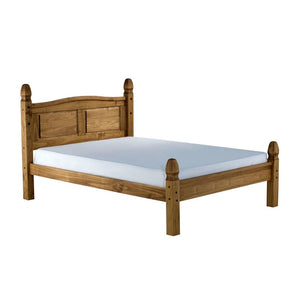 Wooden bed with white mattress on a white background