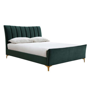 Black upholstered bed with white bedding on a white background