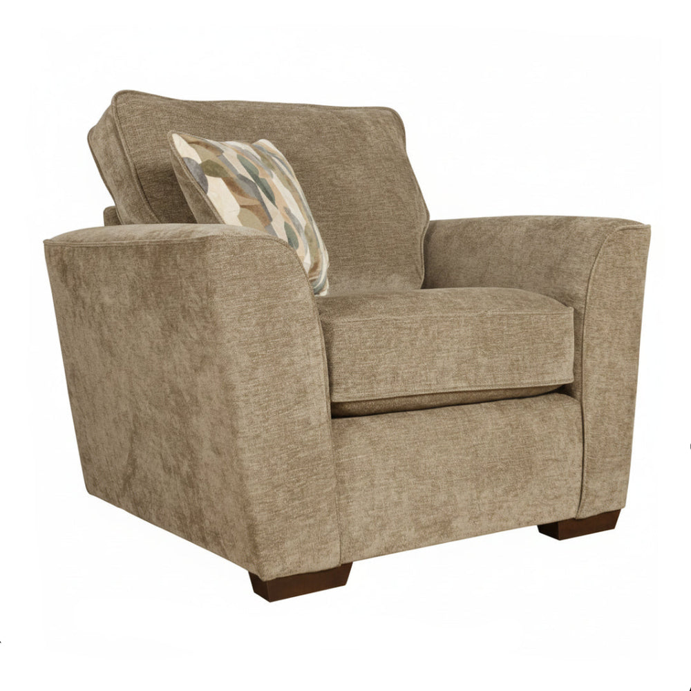 Brown upholstered armchair with a patterned pillow on a white background