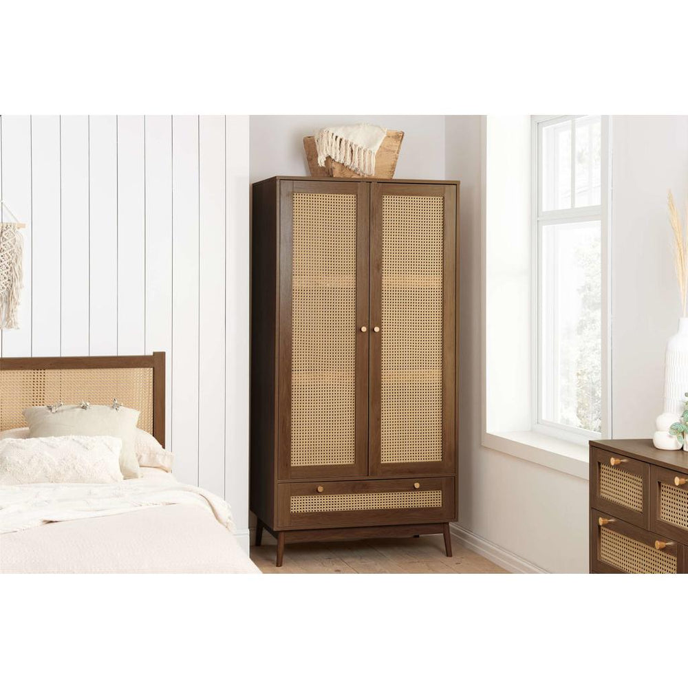 Wooden wardrobe with rattan style doors on a white background