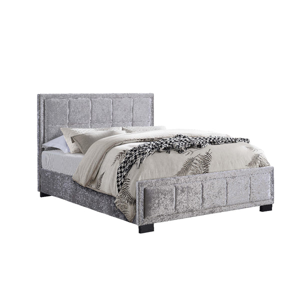 Gray upholstered bed with bedding on a white background