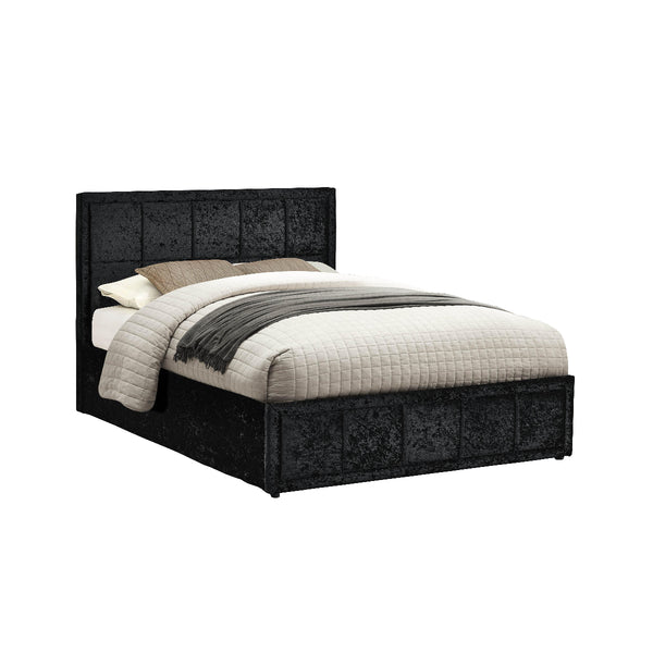 Black upholstered bed with white bedding on a white background