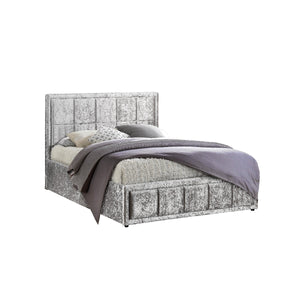 Bed with cube design headboard and bedding on a white background