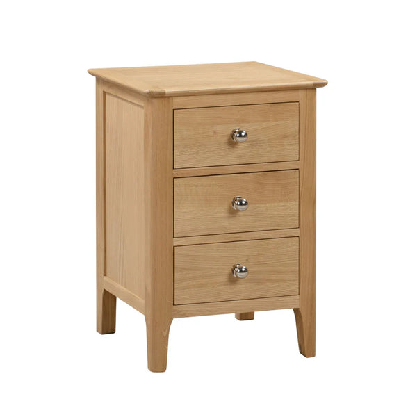 Wooden nightstand with three drawers on a white background