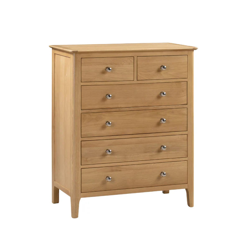 Wooden dresser with multiple drawers on a white background
