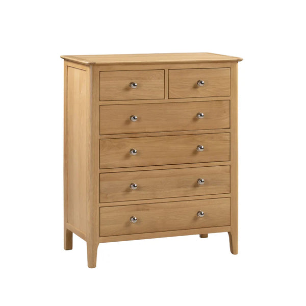 Wooden dresser with multiple drawers on a white background