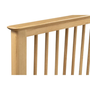 Wooden bed detail on a white background