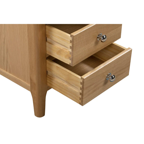 Wooden drawer with two open drawers on a white background