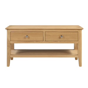 Wooden coffee table with two drawers on a white background
