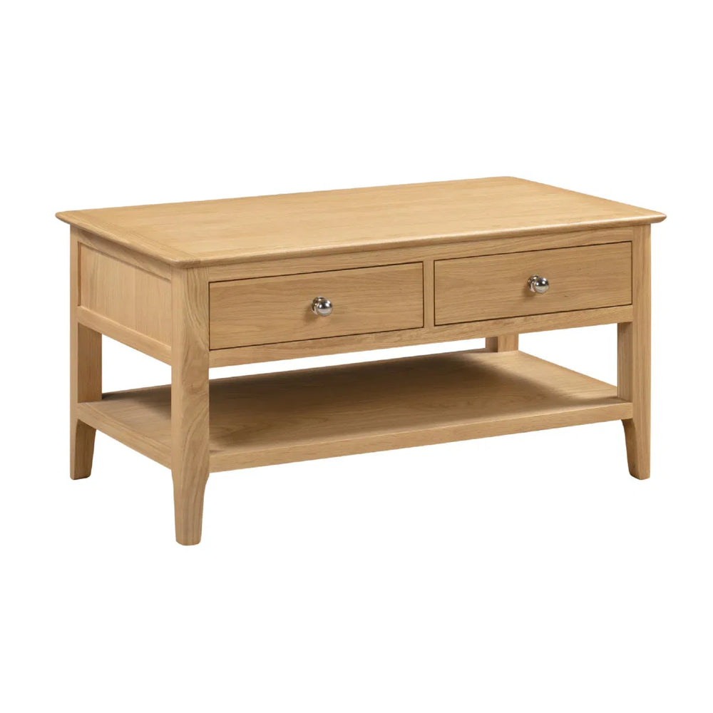 Wooden coffee table with two drawers on a white background