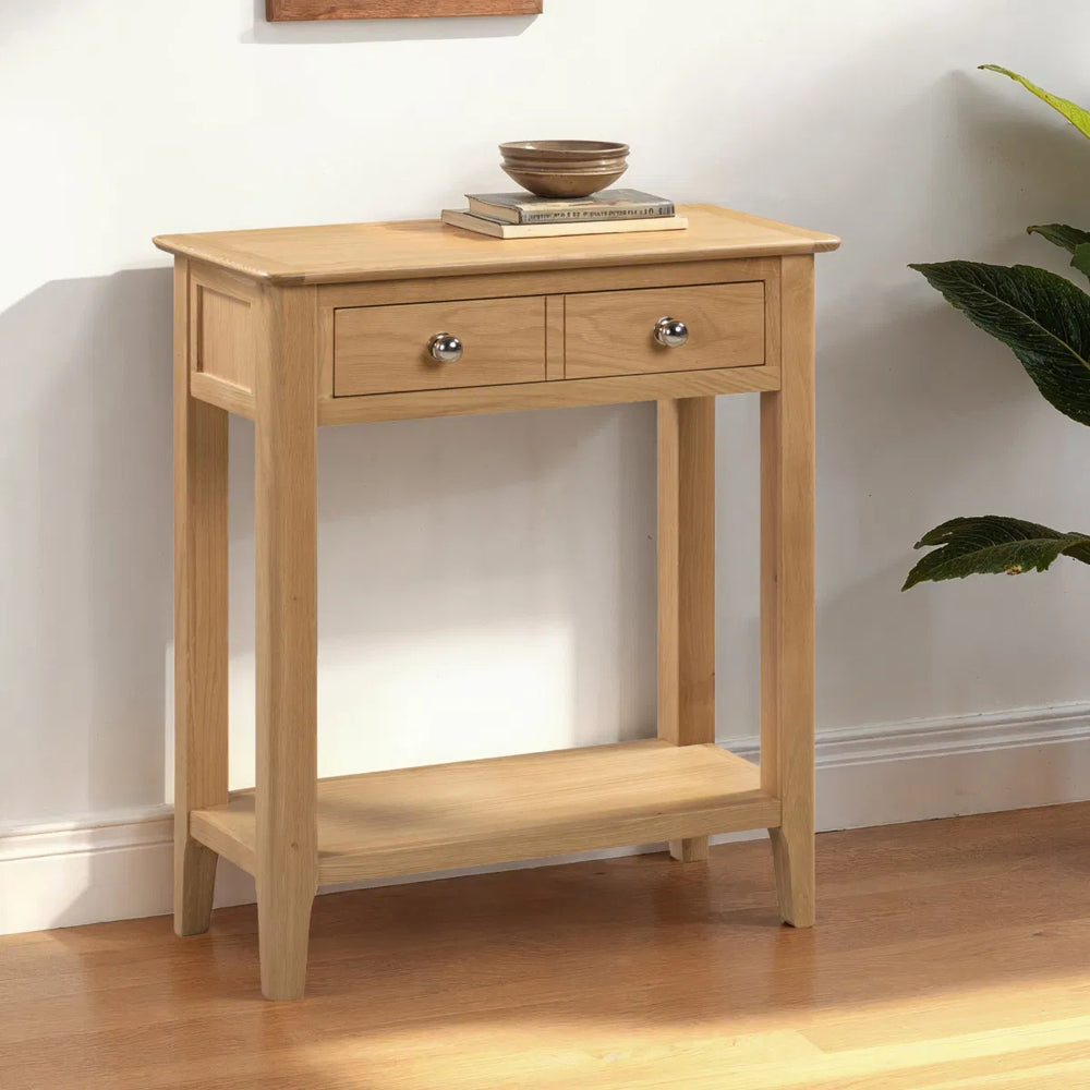 Wooden console table with two drawers on a white background