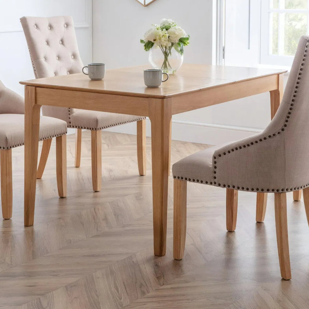 Wooden dining table on a white background