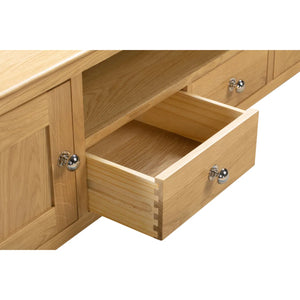 Wooden drawer with silver handles on a white background