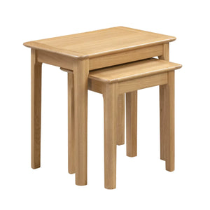 Set of two wooden nesting tables on a white background