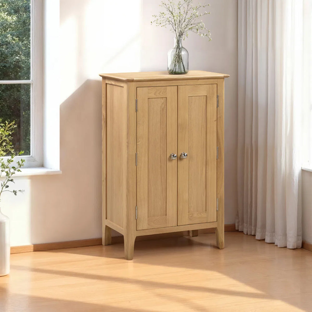 Wooden cabinet with two doors on a white background