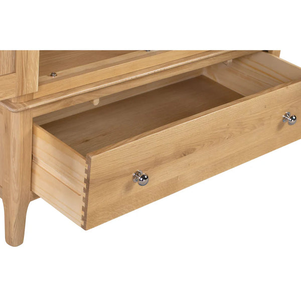 Wooden drawer with metal handles on a white background