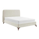 Beige upholstered bed with white mattress on a white background