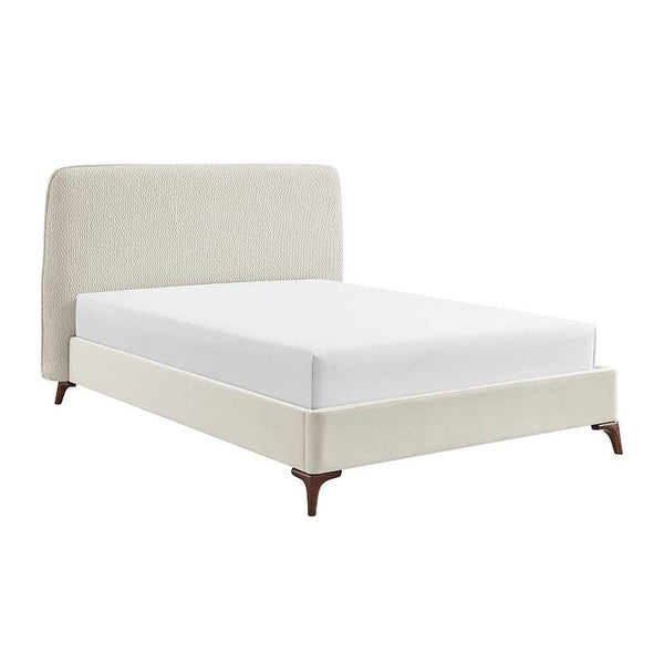 Beige upholstered bed with white mattress on a white background