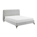 Gray upholstered bed with white mattress on a white background