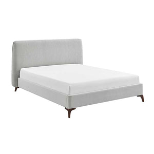 Gray upholstered bed with white mattress on a white background