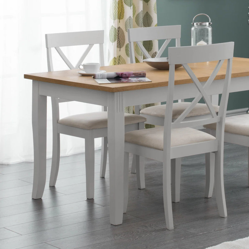 Two white chairs with beige seats on a white background