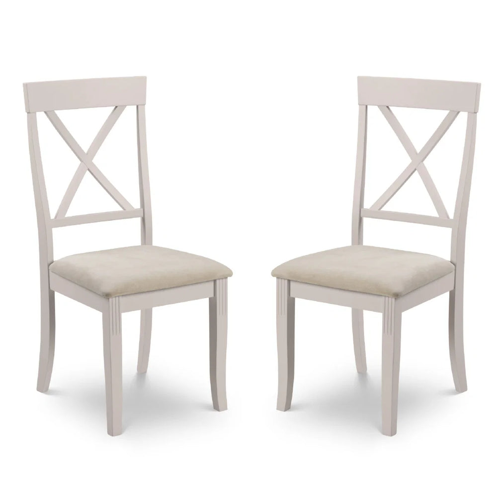 Two white chairs with beige seats on a white background