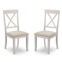 Two white chairs with beige seats on a white background