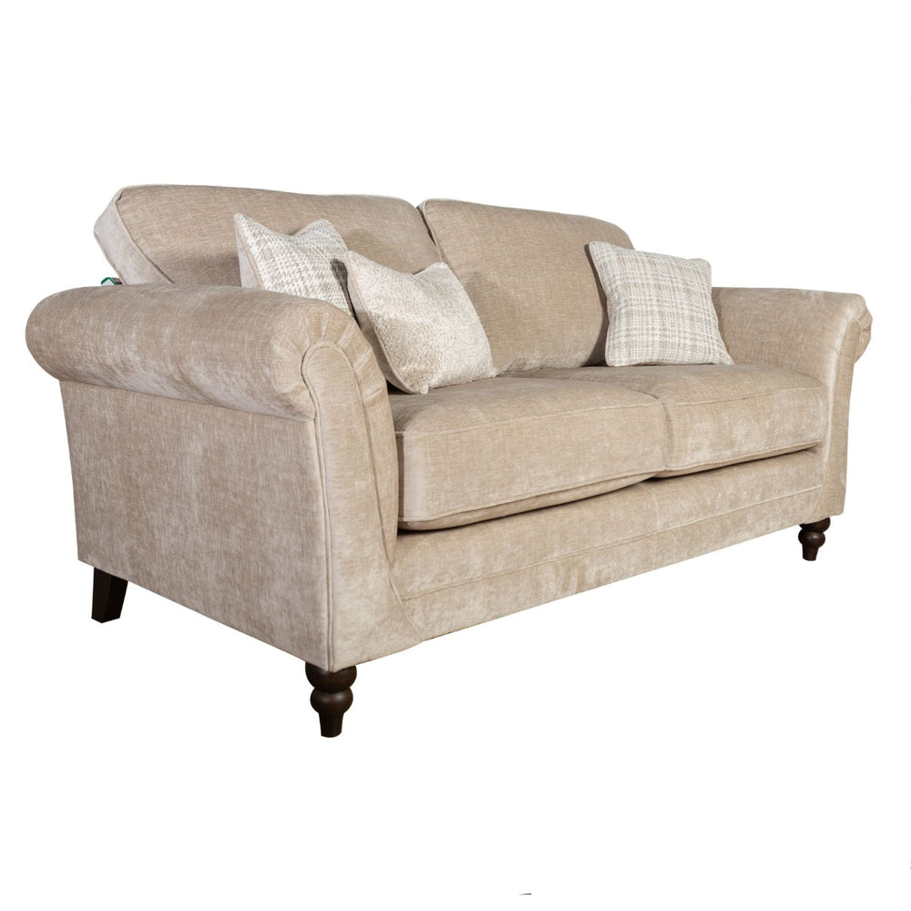 Beige sofa with patterned cushions on a white background