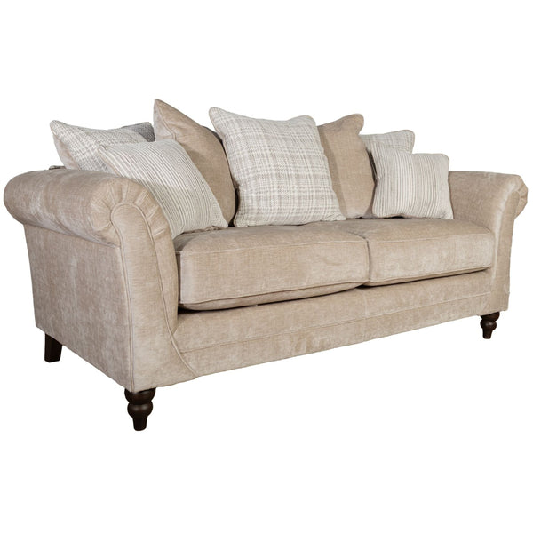 Beige sofa with patterned cushions on a white background