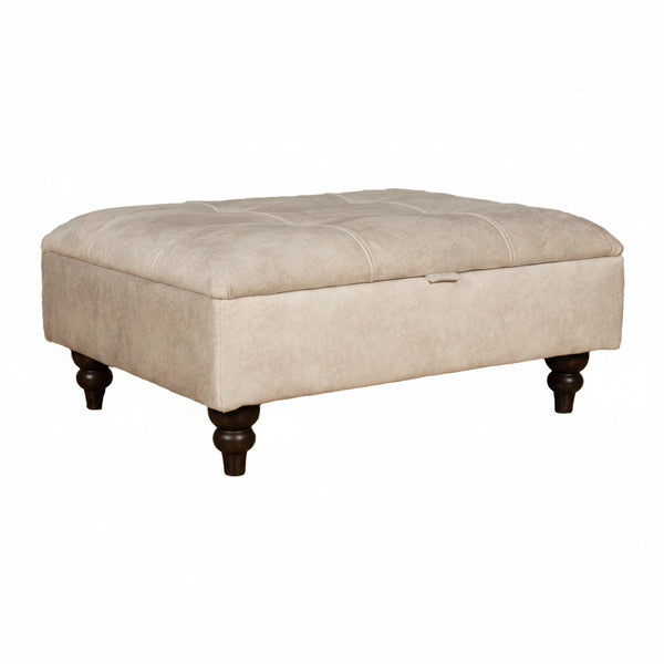 Beige storage ottoman with dark wood legs on a white background
