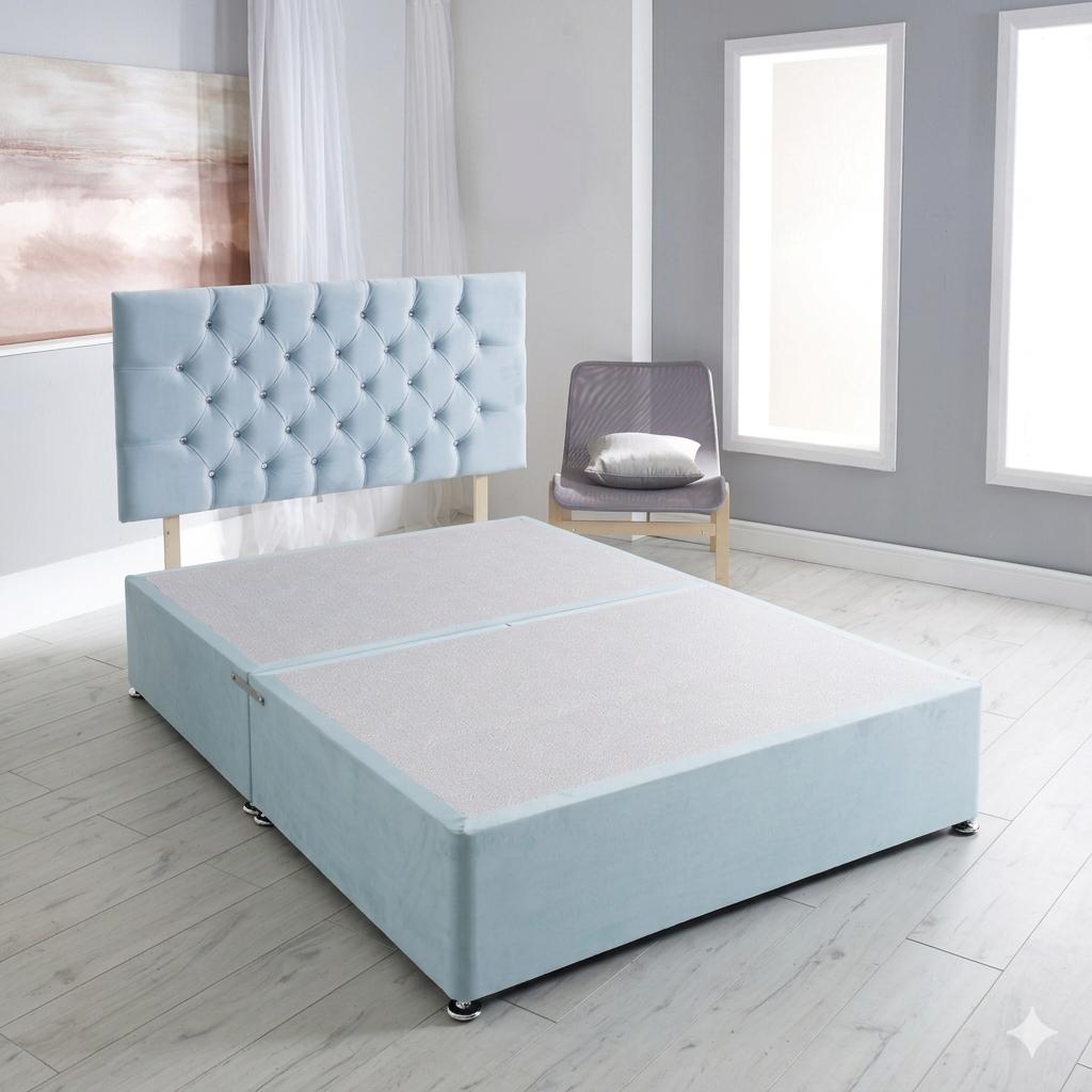 Light blue upholstered bed in a room with a chair and windows.