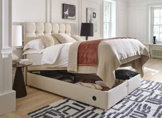Modern bedroom with a bed, nightstands, and decorative elements.