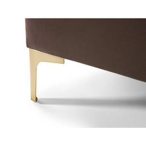 Brown upholstered chair with gold metal legs on a white background