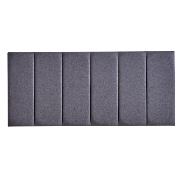 Gray upholstered headboard with a pleated design on a white background