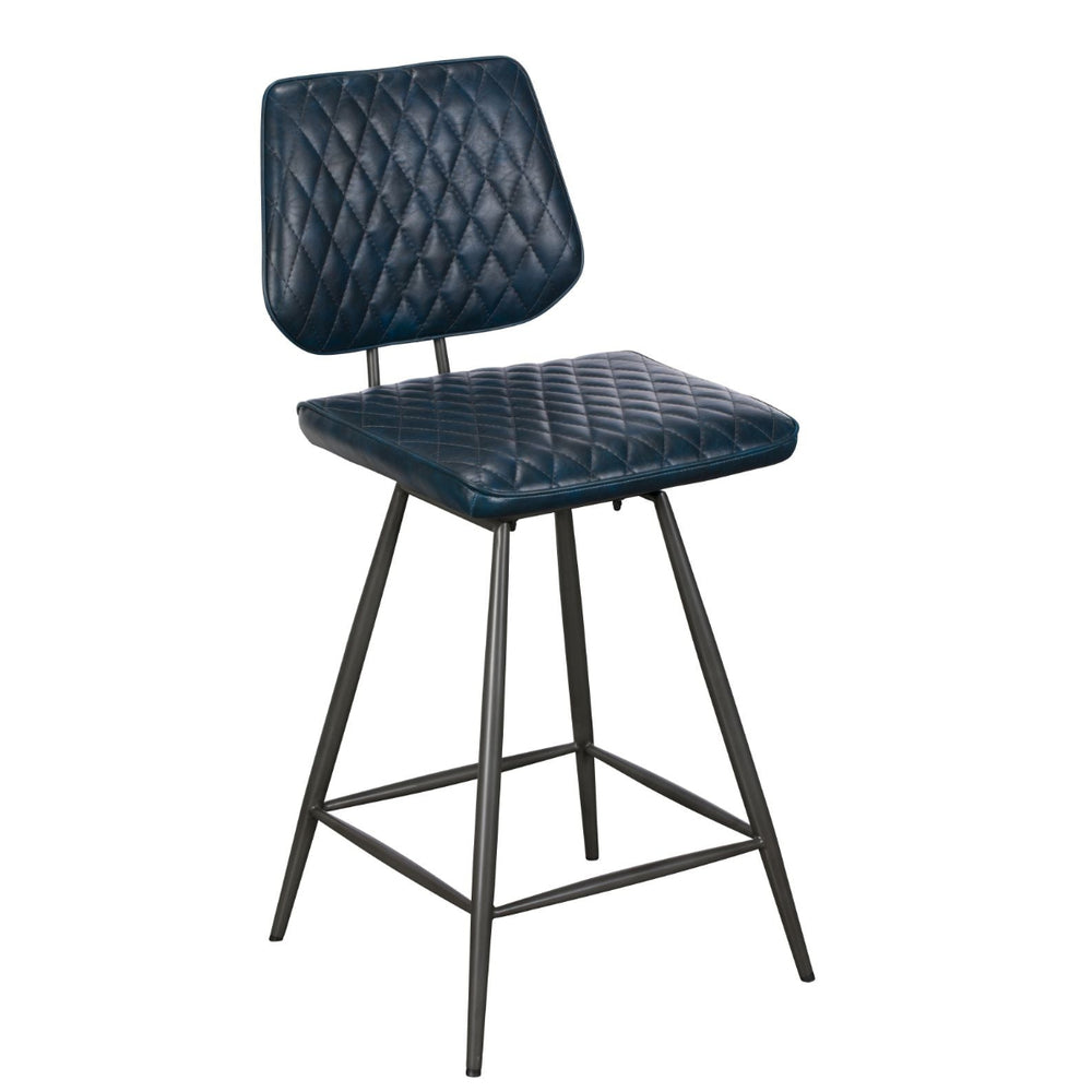 Black quilted bar stool in a modern room with wooden furniture and large windows.