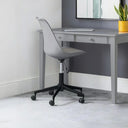 Gray office desk with a chair in a room with a plant and mirror.