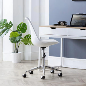 White office chair in a modern office setting with a desk and plant.
