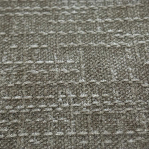 Close-up of a textured gray fabric with a subtle pattern