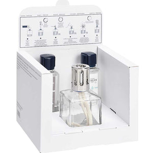 Perfume bottle with packaging and instruction sheet on a white background