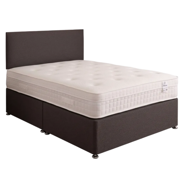 Bed with white mattress and brown frame on a white background