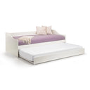 White bed with a purple mattress and decorative pillows on a white background