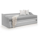 Gray daybed with white pillows and a blanket on a white background
